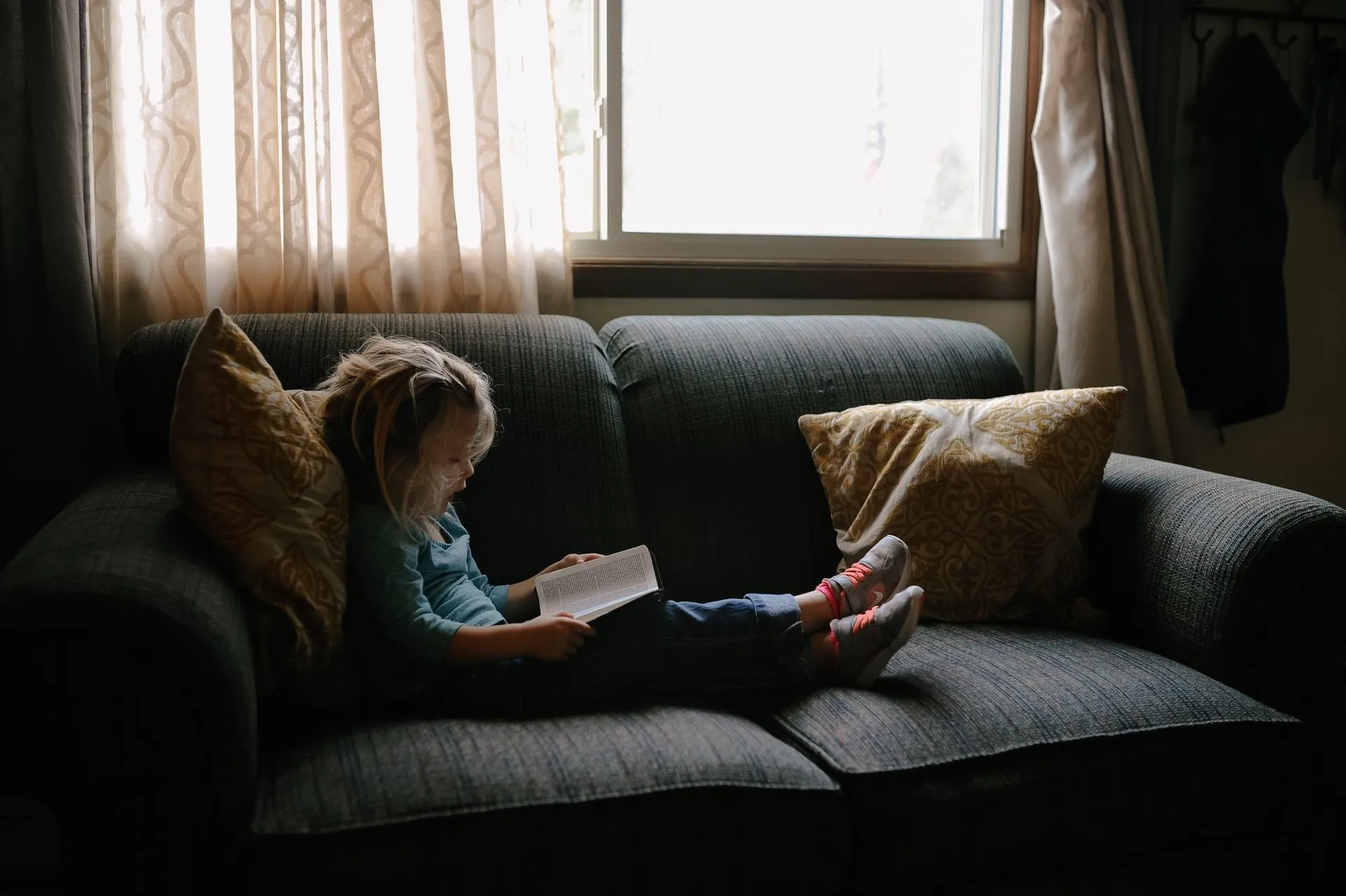 Photo of a girl sitting on a couch